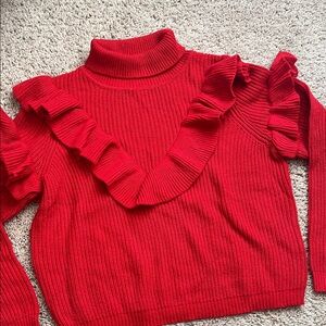 Red knit ruffle turtleneck sweater